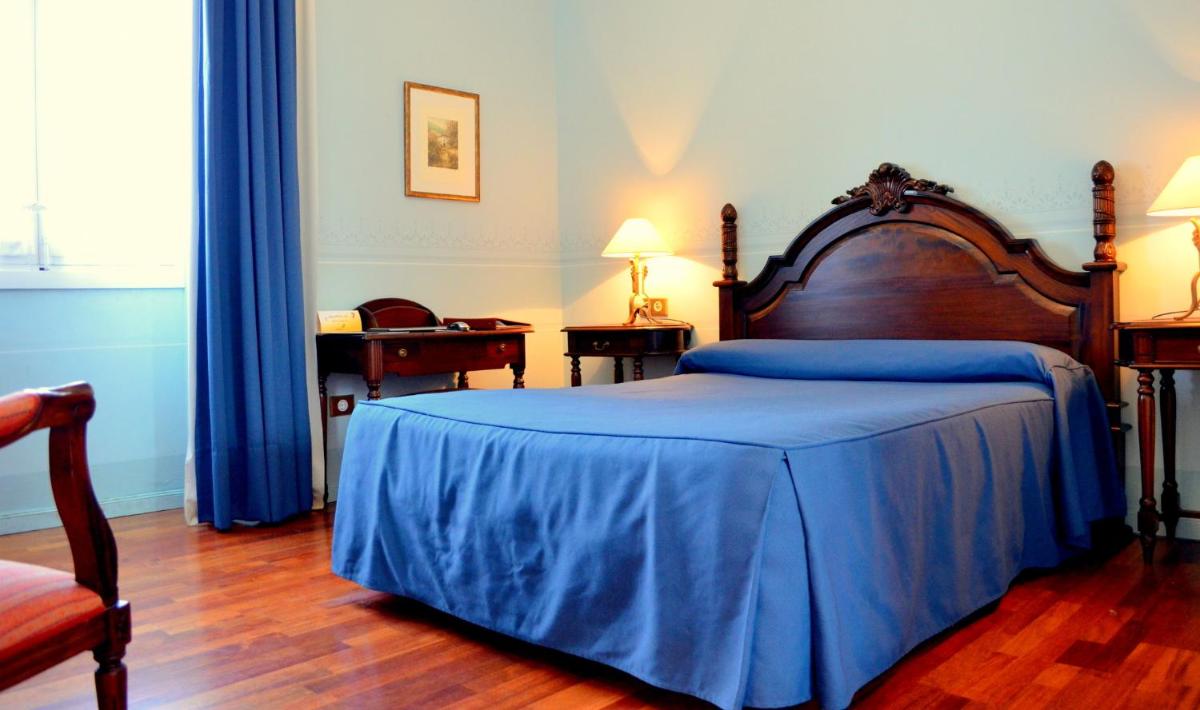 Cama o camas de una habitación en Hotel Mirador de Llerena