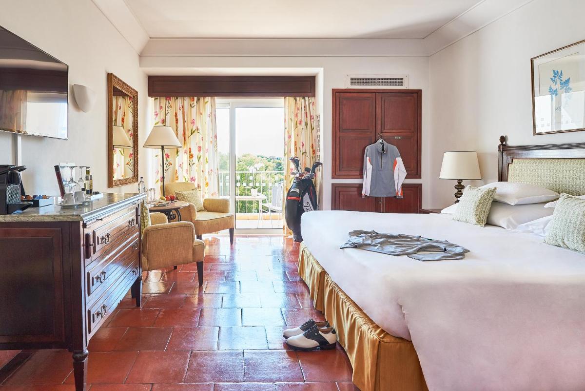 Uma cama ou camas num quarto em Dona Filipa Hotel
