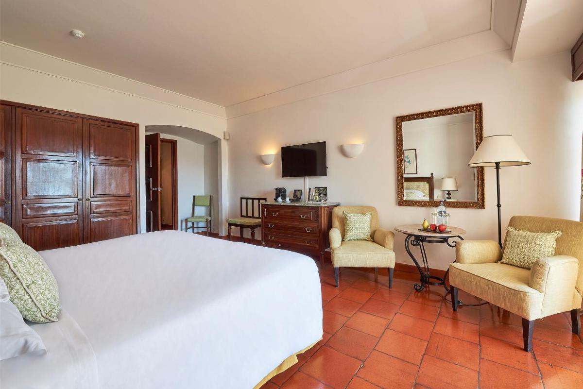 Uma cama ou camas num quarto em Dona Filipa Hotel