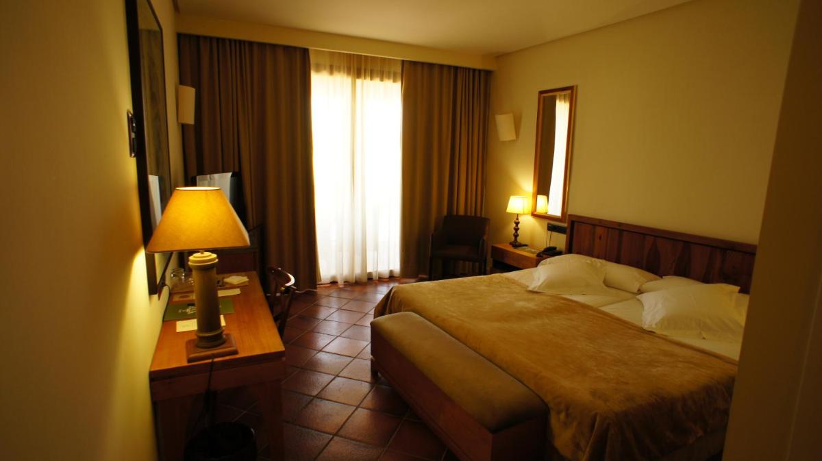 Cama o camas de una habitación en Hotel Cigarral el Bosque