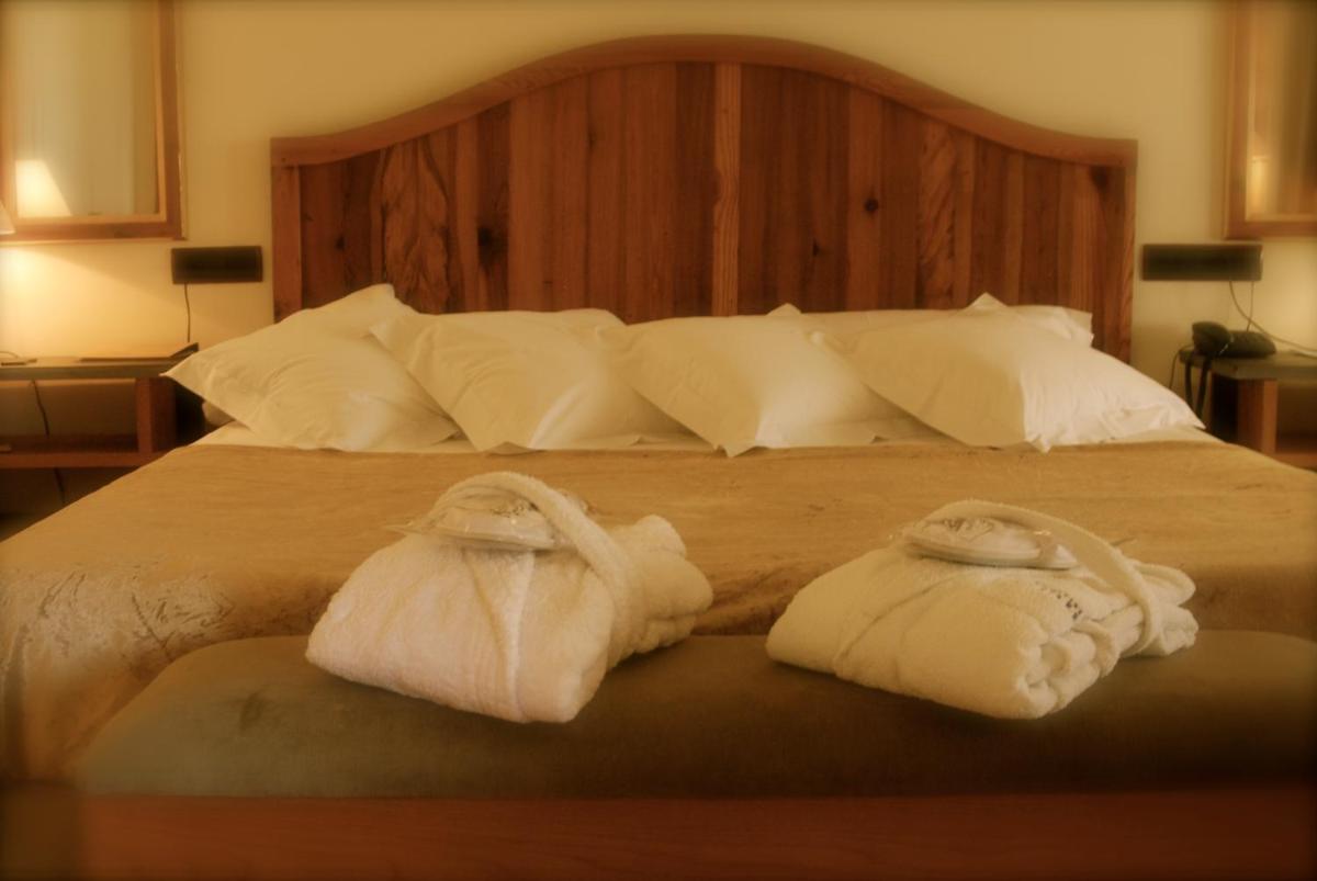 Cama o camas de una habitación en Hotel Cigarral el Bosque
