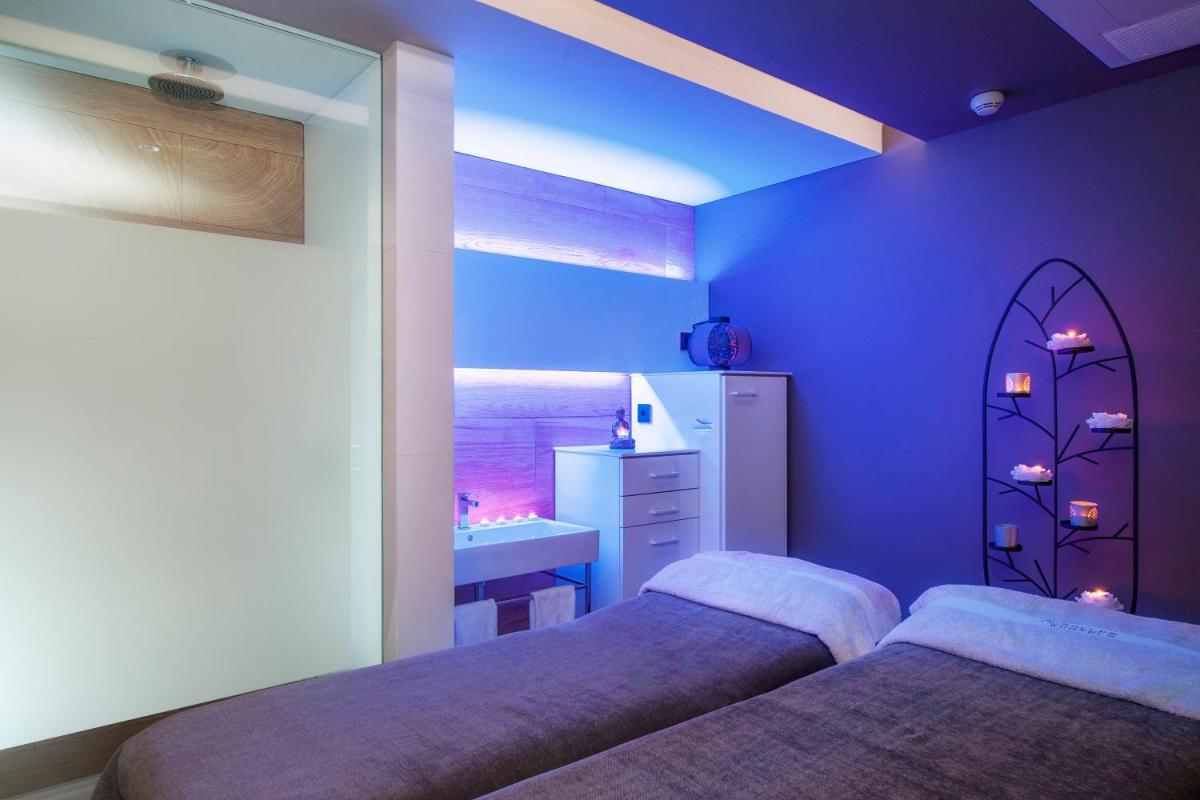 Cama o camas de una habitación en Sallés Hotel Pere IV