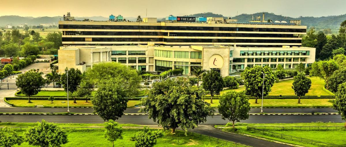 a large building with a clock tower in front of it at The Lalit Chandigarh in Chandīgarh