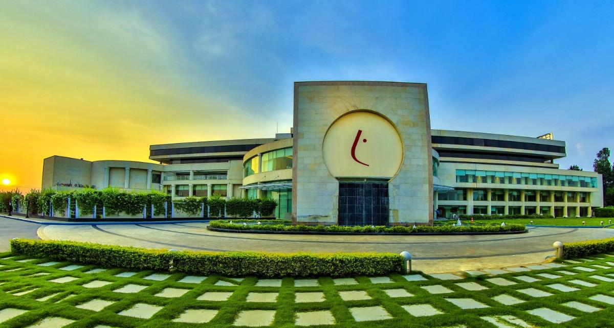 a building with a clock on the side of it at The Lalit Chandigarh in Chandīgarh