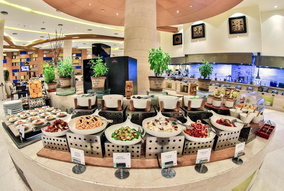 a buffet of food on display in a mall at The Lalit Chandigarh in Chandīgarh