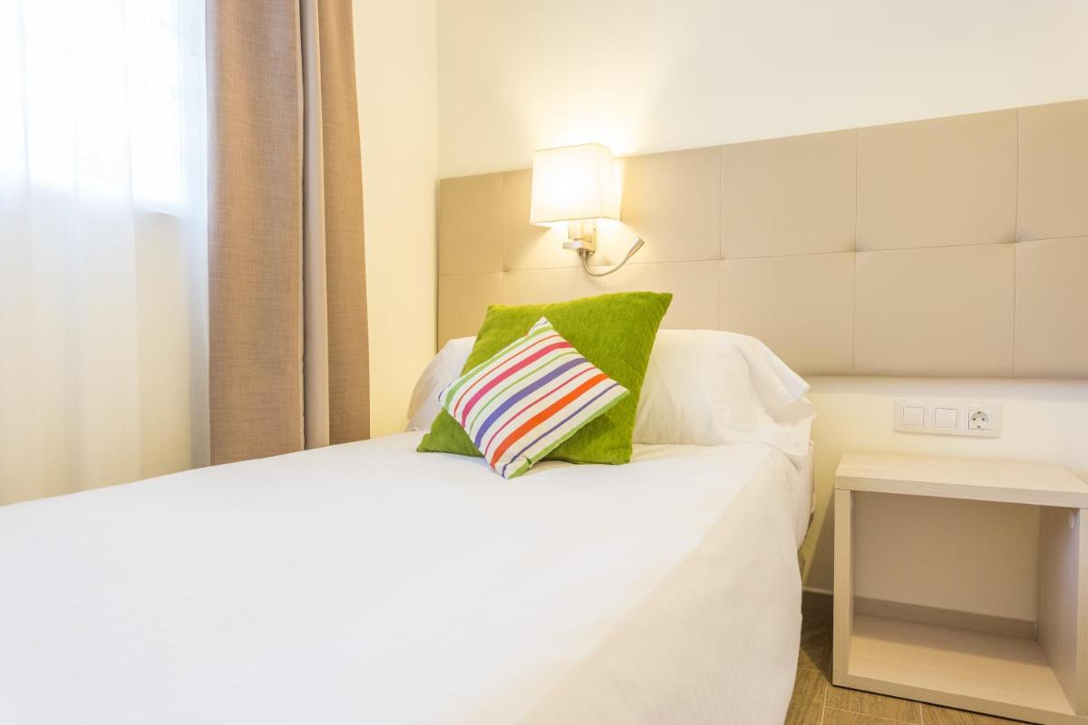 Cama o camas de una habitación en Ferrer Janeiro Hotel & Spa