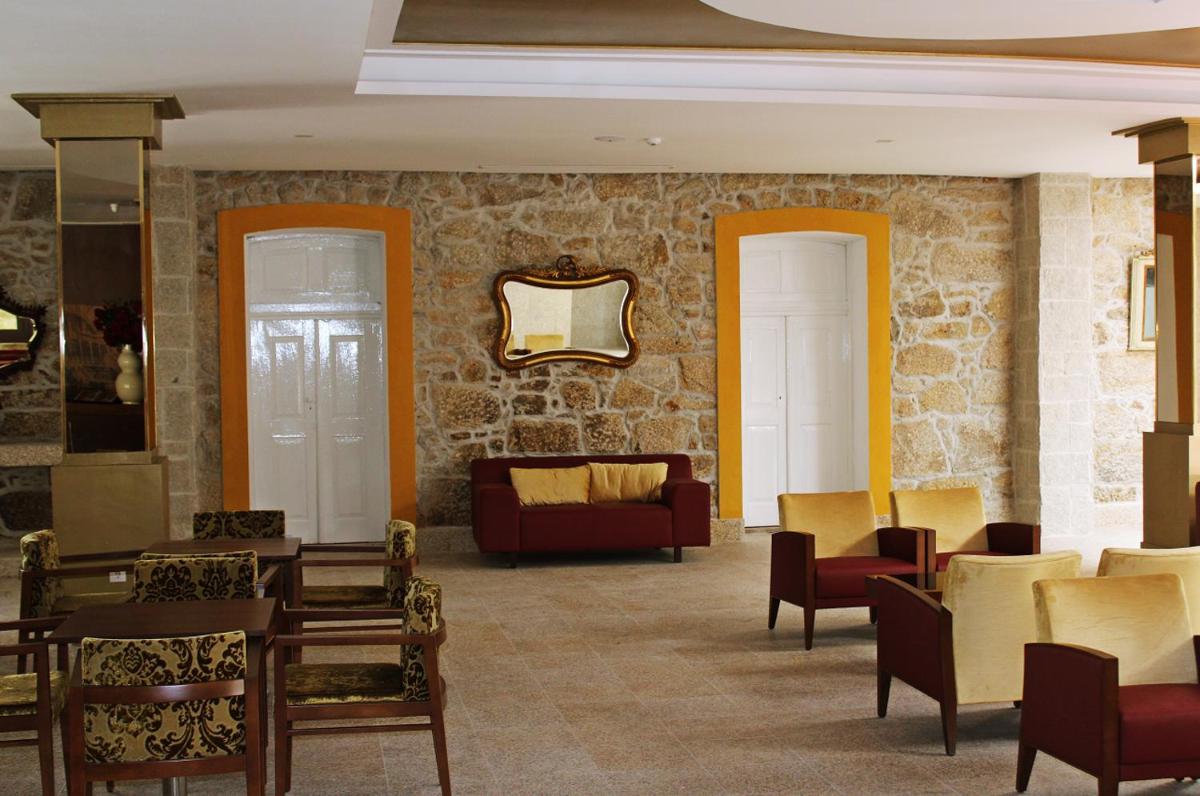 Uma área de estar em Palace Hotel Astúrias & Spa