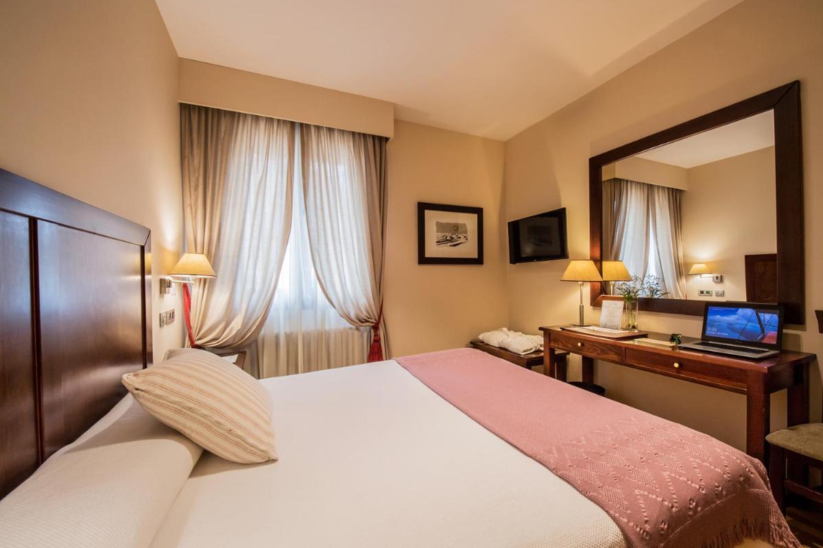 Cama o camas de una habitación en Hotel Villa Virginia