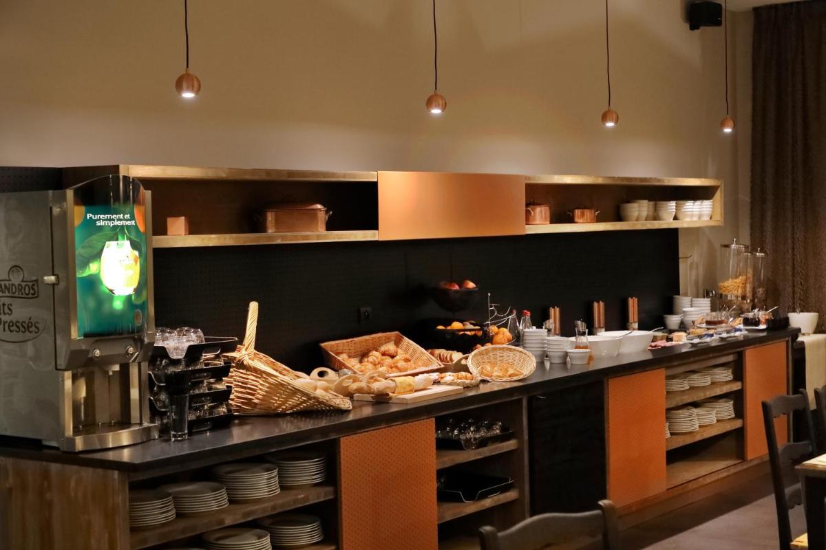 Cuisine ou kitchenette dans l'établissement Hotel de la Jamagne & Spa