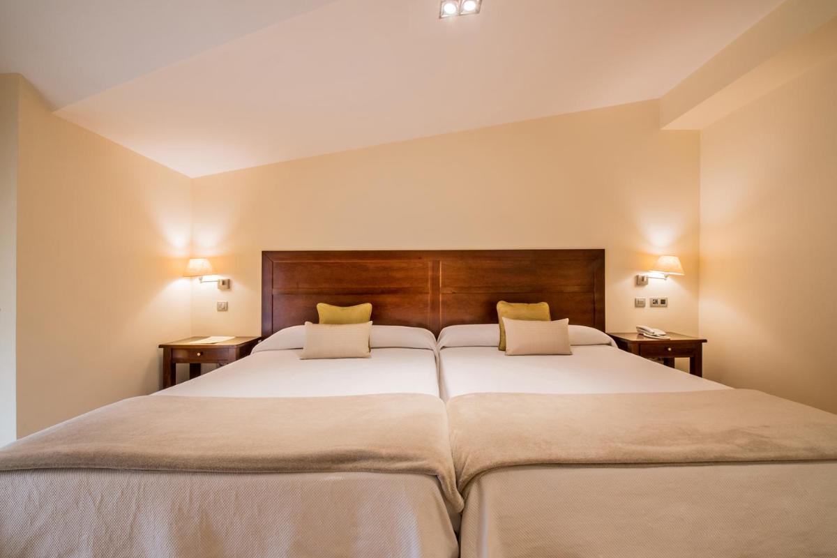Cama o camas de una habitación en Hotel Villa Virginia