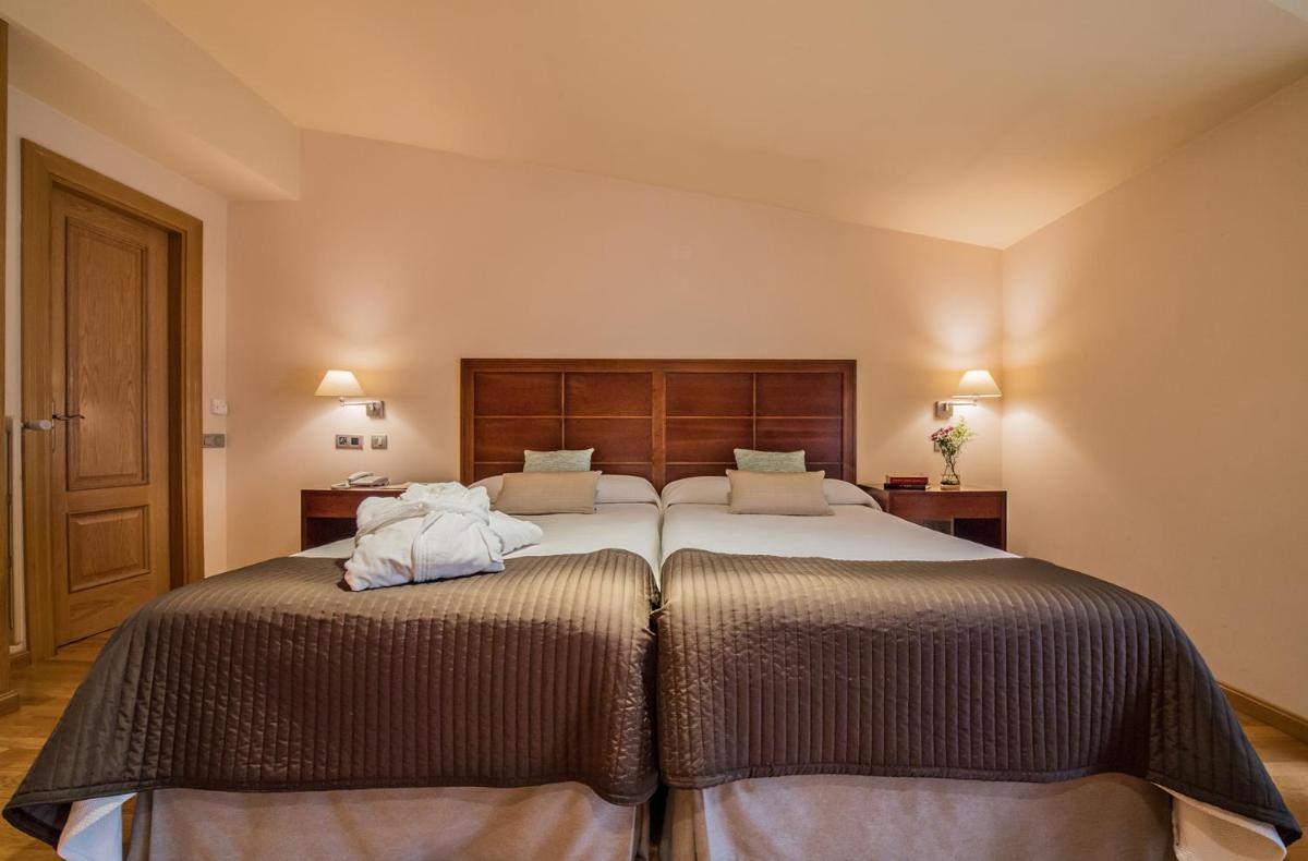 Cama o camas de una habitación en Hotel Villa Virginia