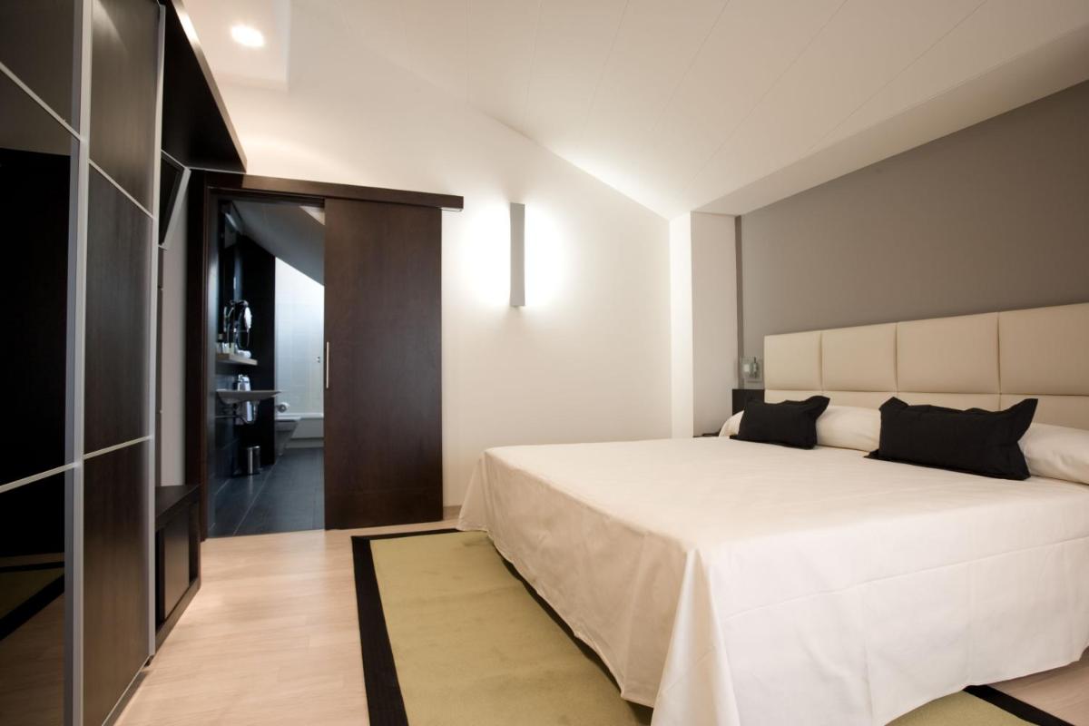 Cama o camas de una habitación en Hotel Bienestar Moaña