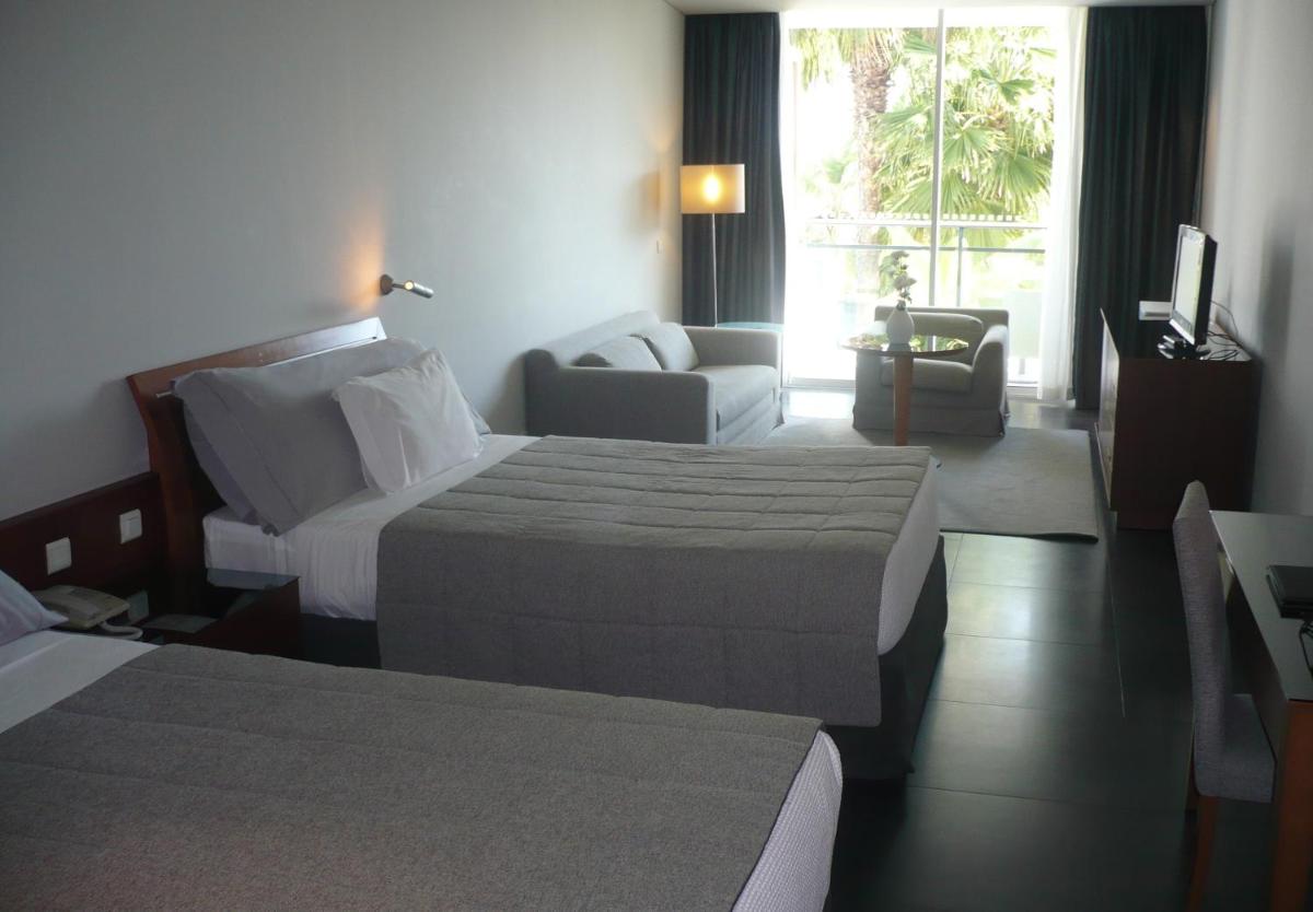 Uma cama ou camas num quarto em VidaMar Resort Hotel Madeira