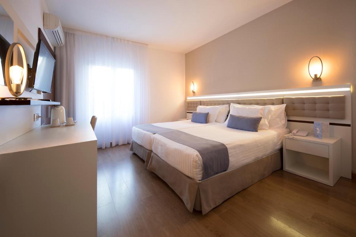Cama o camas de una habitación en Park Hotel San Jorge & Spa by Escampa Hotels