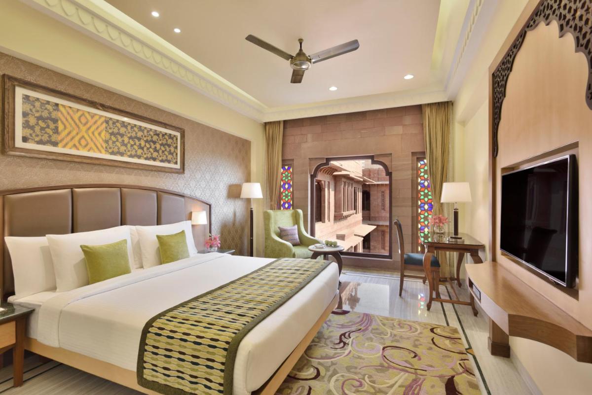 a hotel room with a bed and a television at Radisson Jodhpur in Jodhpur
