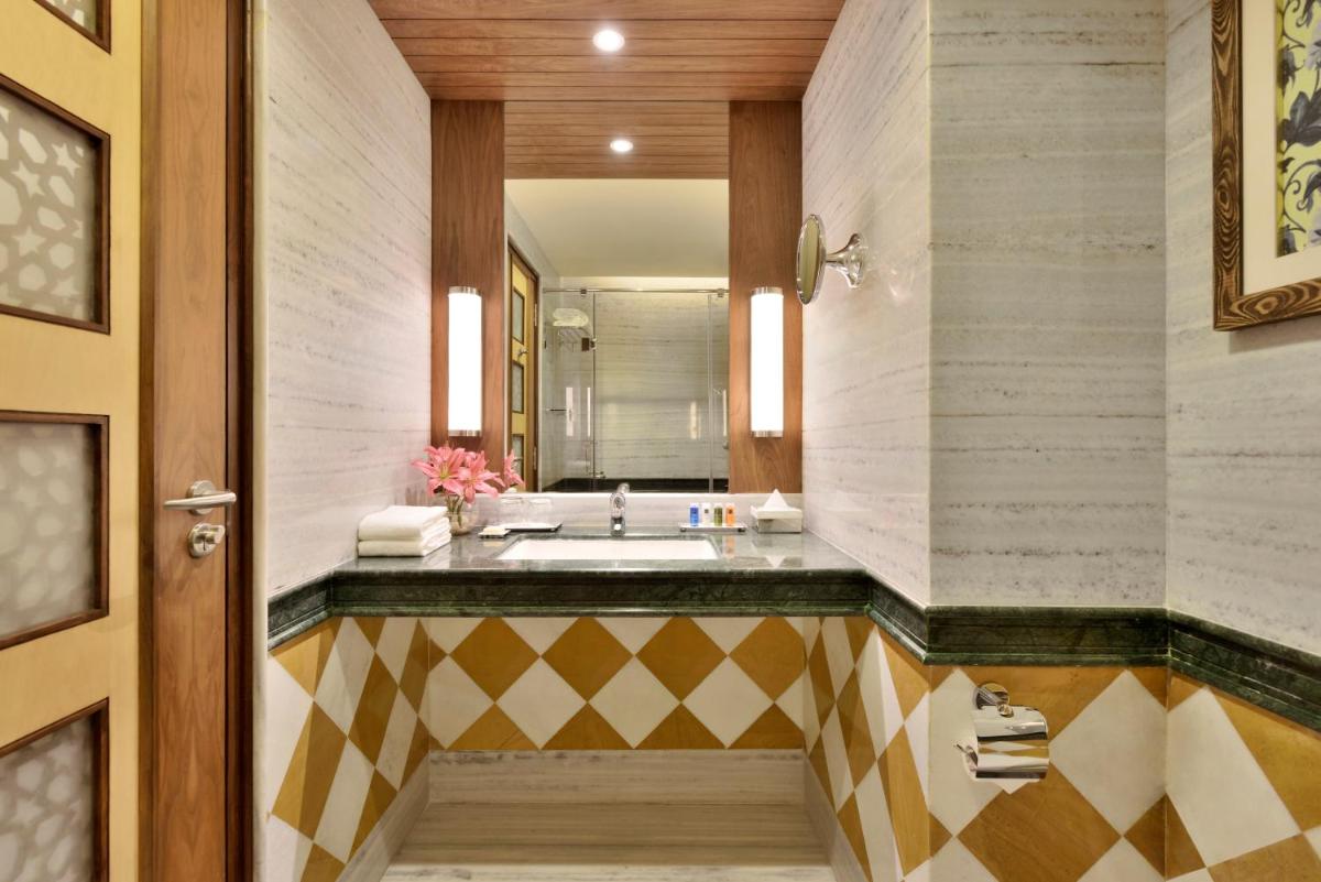 a bathroom with a sink and a mirror at Radisson Jodhpur in Jodhpur