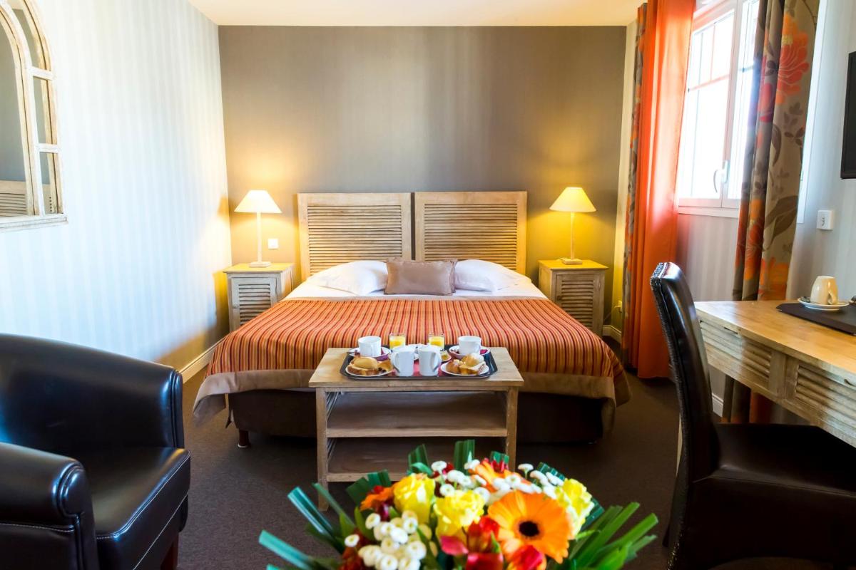 Un ou plusieurs lits dans un hébergement de l'établissement Almoria Hôtel & SPA