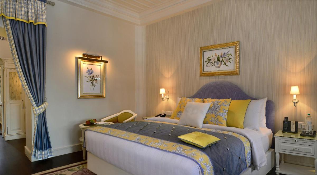 a bedroom with a large bed in a room at Welcomhotel by ITC Hotels, The Savoy, Mussoorie in Mussoorie