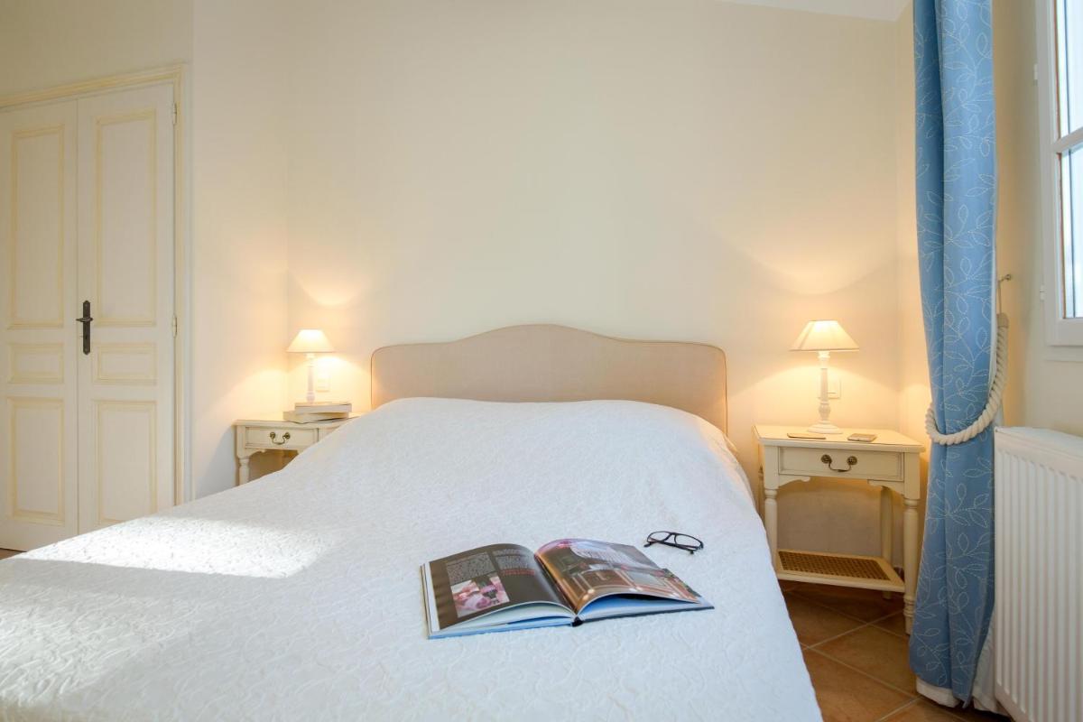 Un ou plusieurs lits dans un hébergement de l'établissement Les Appartements et Maisons du Domaine de Saint Endréol Golf & Spa Resort