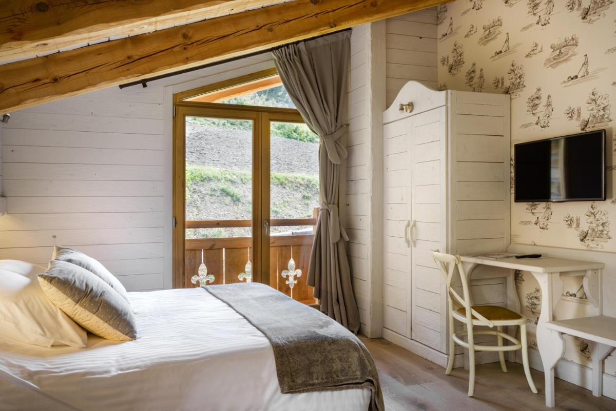 Cama o camas de una habitación en Hotel Viñas de Lárrede