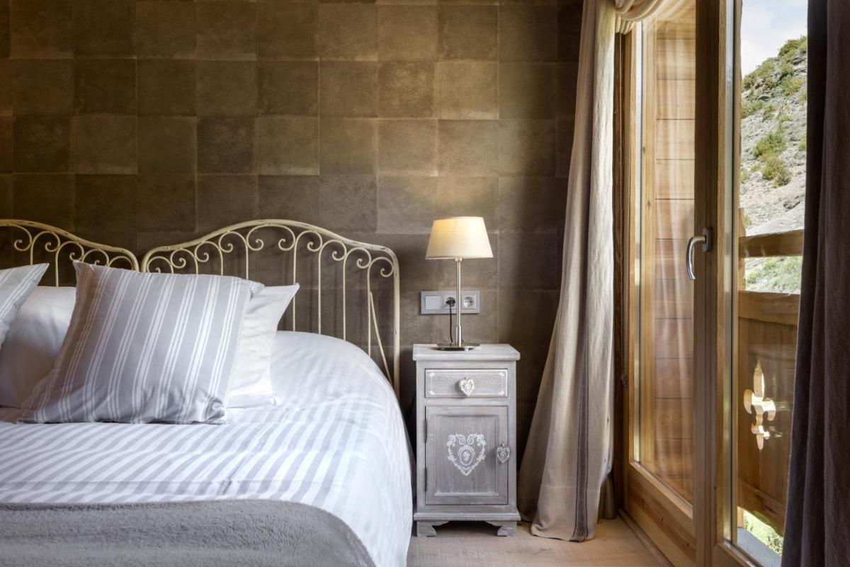 Cama o camas de una habitación en Hotel Viñas de Lárrede