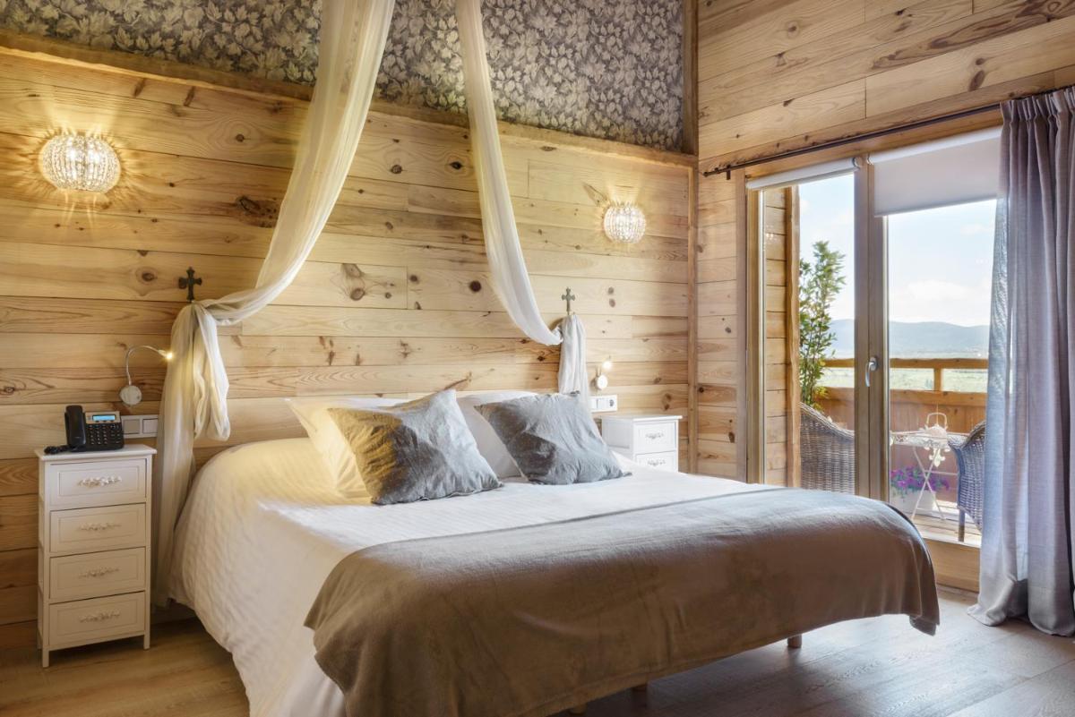 Cama o camas de una habitación en Hotel Viñas de Lárrede