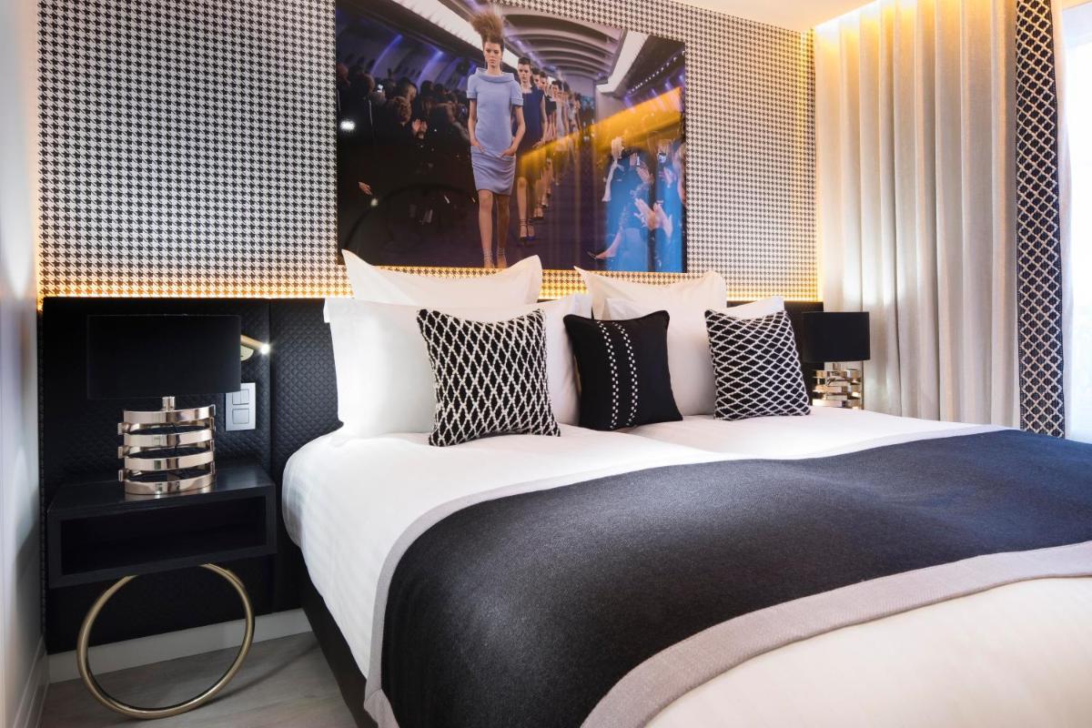 Un ou plusieurs lits dans un hébergement de l'établissement Hôtel Dress Code