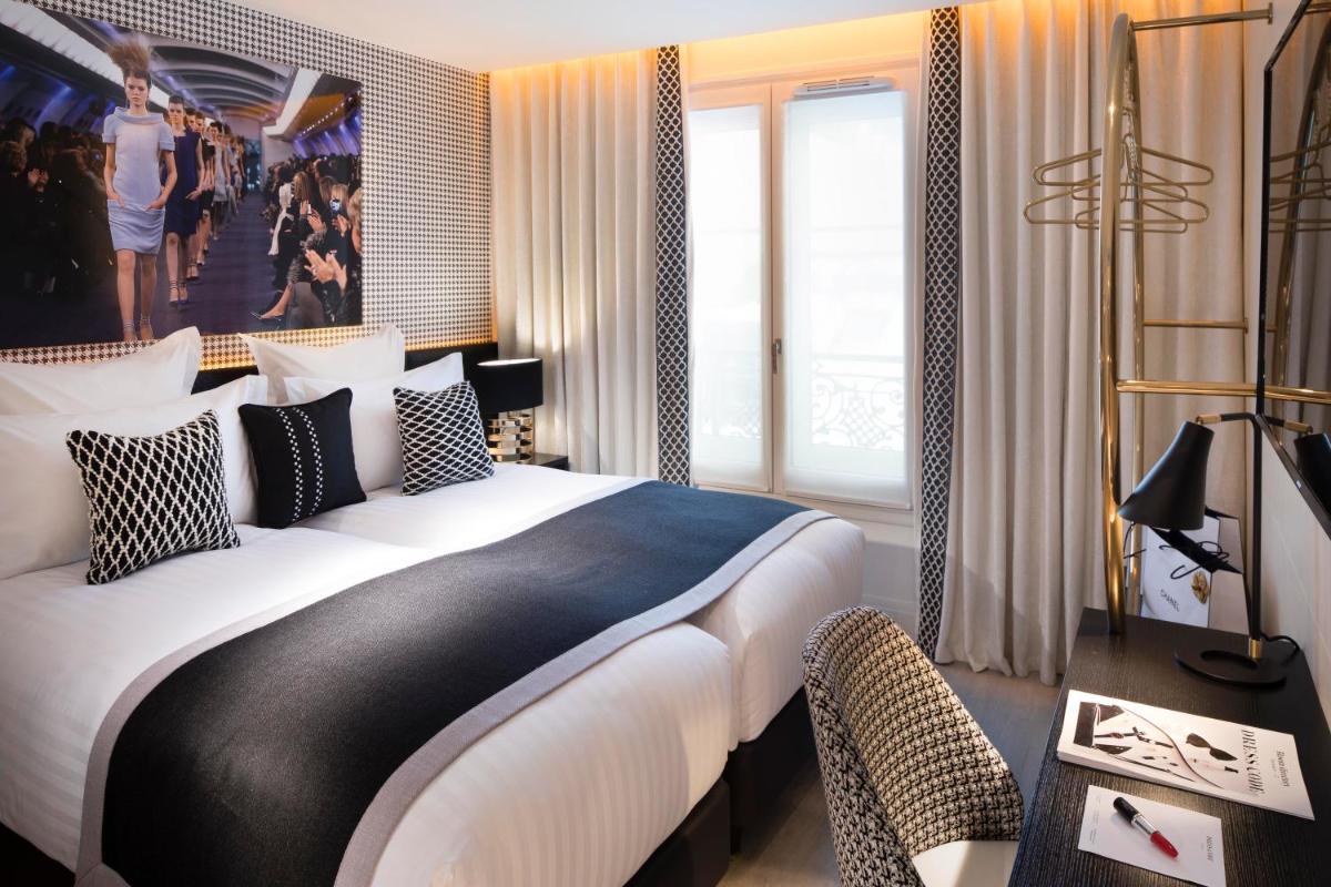 Un ou plusieurs lits dans un hébergement de l'établissement Hôtel Dress Code