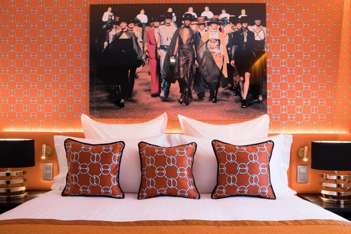 Un ou plusieurs lits dans un hébergement de l'établissement Hôtel Dress Code