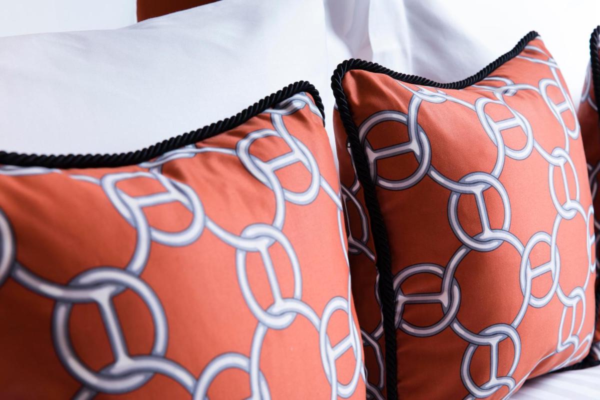 Un ou plusieurs lits dans un hébergement de l'établissement Hôtel Dress Code