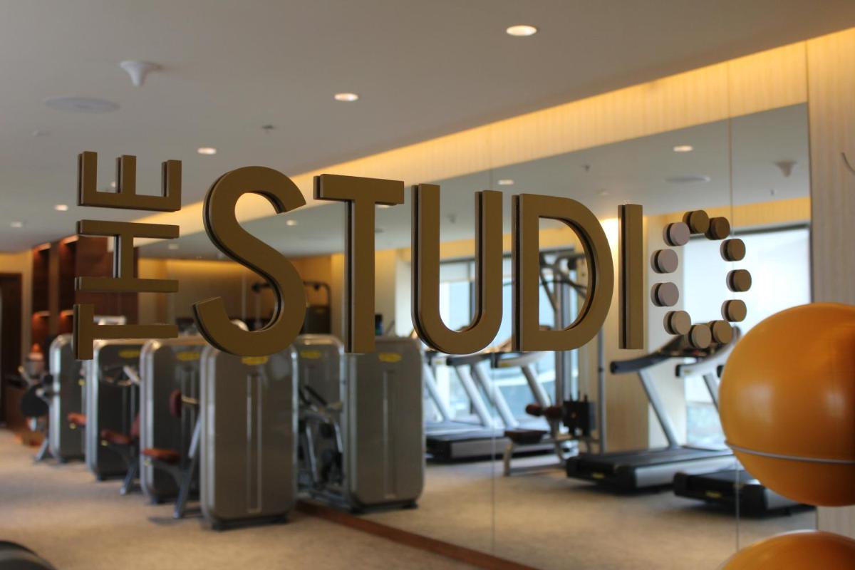 a gym with the word spin in a room at The Den, Bengaluru in Bengaluru