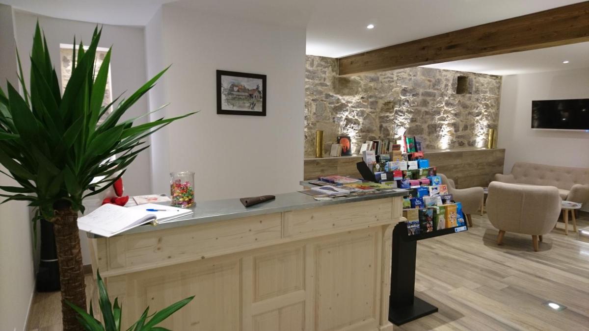 Télévision ou salle de divertissement dans l'établissement Le Moulin d'Oscar & Spa - Mulhouse Nord
