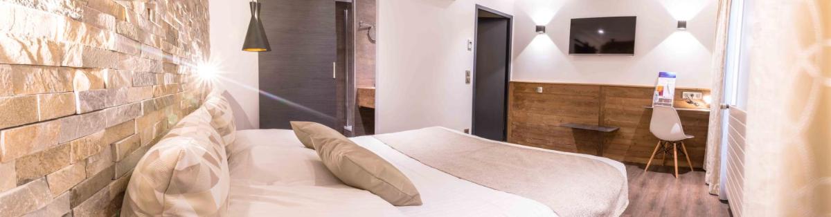 Un ou plusieurs lits dans un hébergement de l'établissement Hôtel des Princes, Chambéry Centre