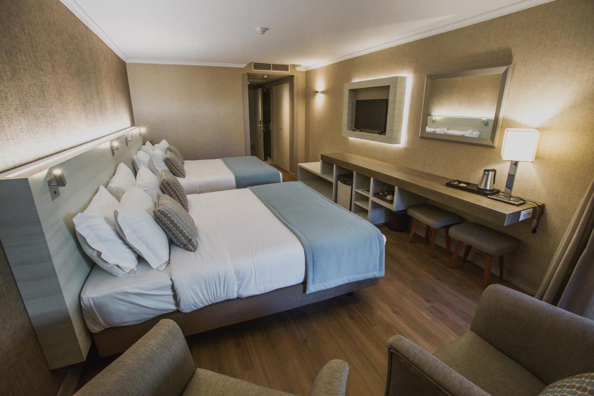 Uma cama ou camas num quarto em Enotel Lido - All Inclusive