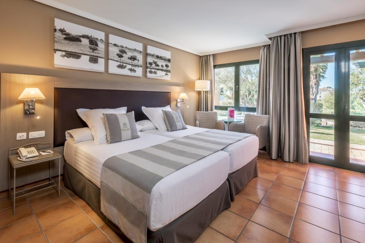 Cama o camas de una habitación en Barceló Montecastillo Golf