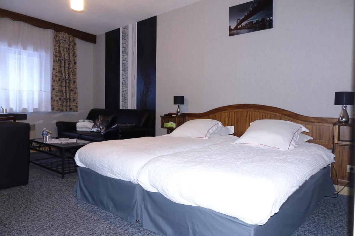 Un ou plusieurs lits dans un hébergement de l'établissement Hotel-Spa & Restaurant Logis Domaine Langmatt