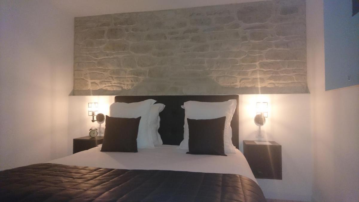 Un ou plusieurs lits dans un hébergement de l'établissement Le Moulin d'Oscar & Spa - Mulhouse Nord