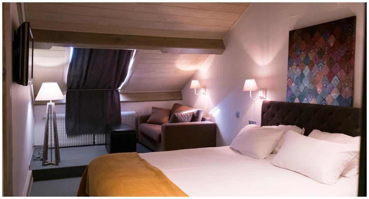 Un ou plusieurs lits dans un hébergement de l'établissement Hotel Corrieu
