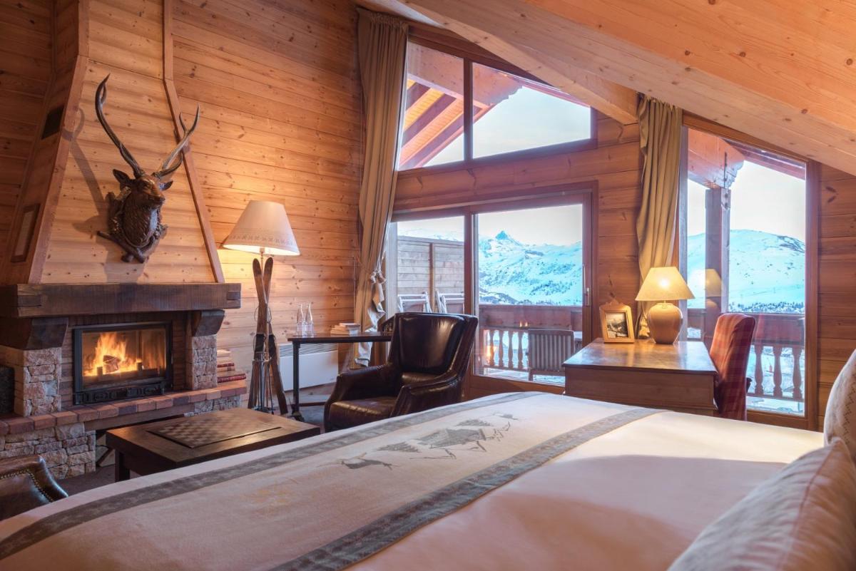 Un ou plusieurs lits dans un hébergement de l'établissement Hôtel Au Chamois d'Or by Les Etincelles