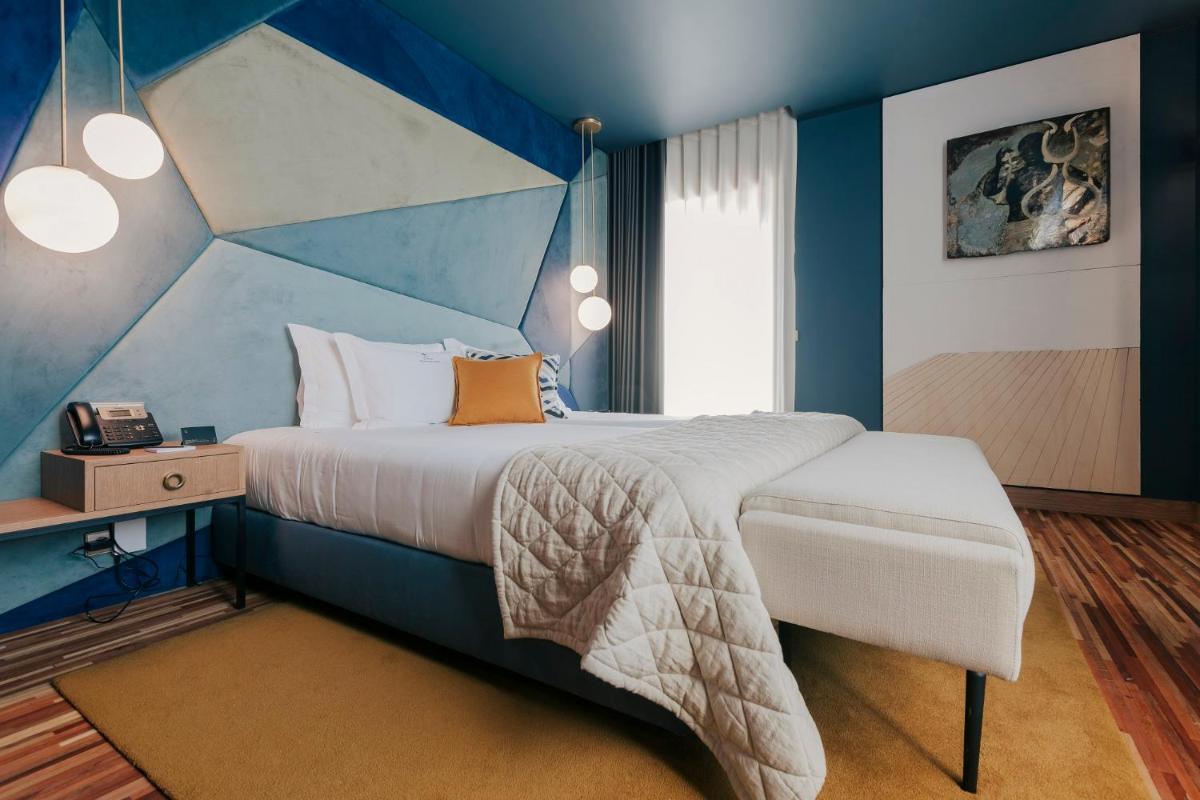 Uma cama ou camas num quarto em Torel Avantgarde