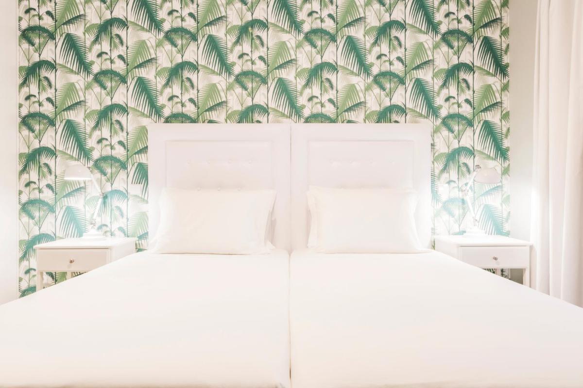 Uma cama ou camas num quarto em Eden Villas & Apartments