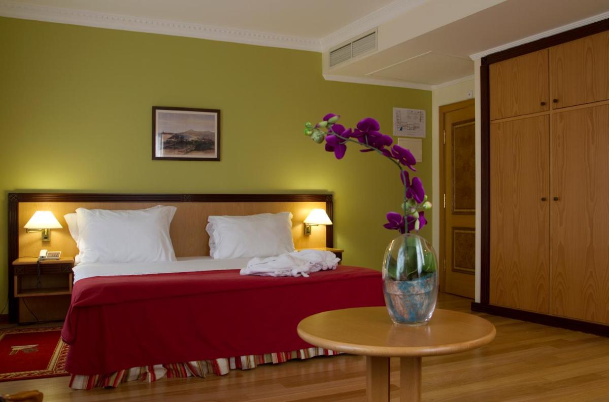 Uma cama ou camas num quarto em Hotel Quinta Bela S Tiago