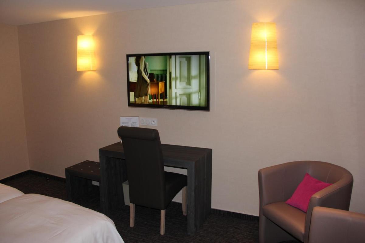 Télévision ou salle de divertissement dans l'établissement Hotel de la Jamagne & Spa