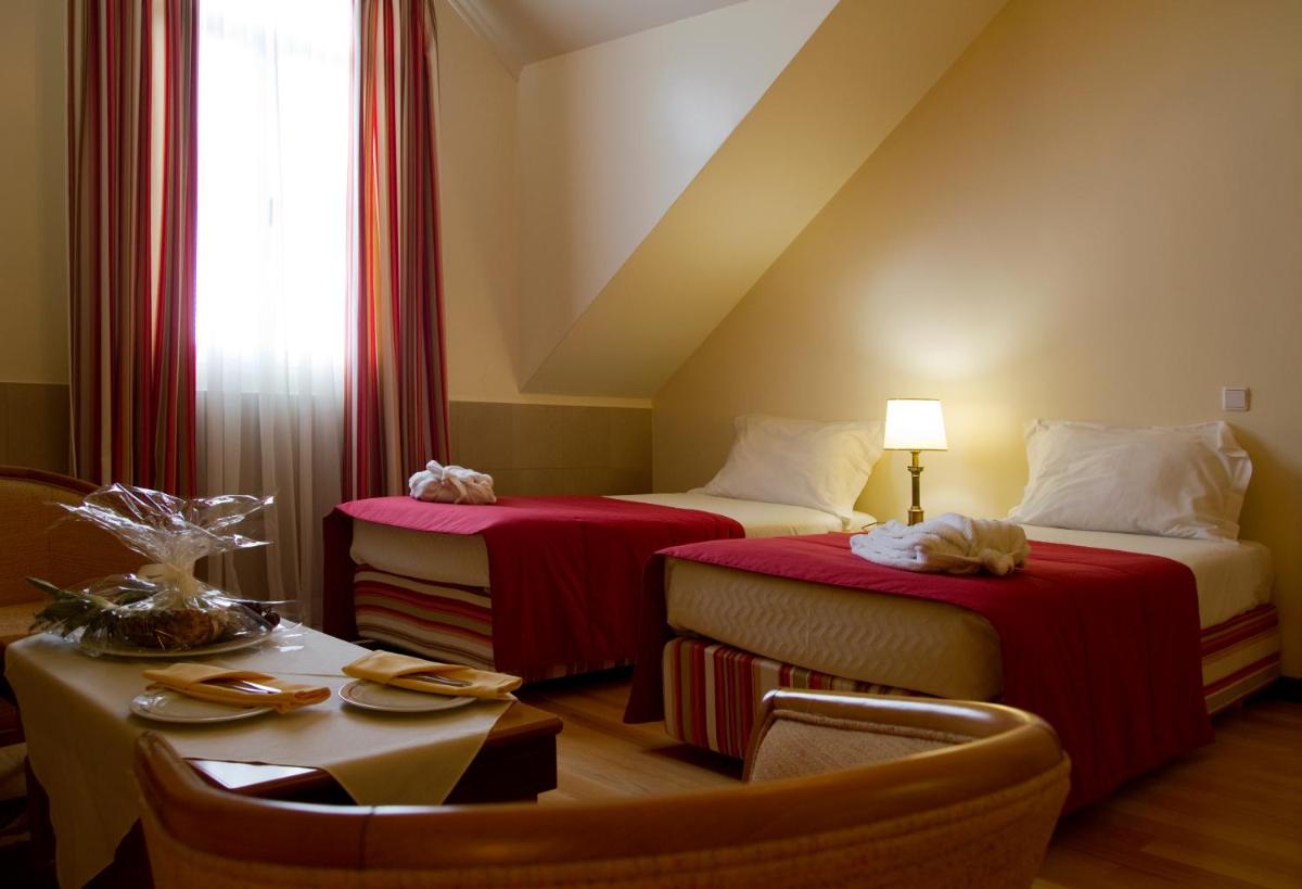 Uma cama ou camas num quarto em Hotel Quinta Bela S Tiago