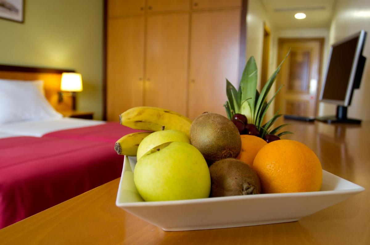 Uma cama ou camas num quarto em Hotel Quinta Bela S Tiago