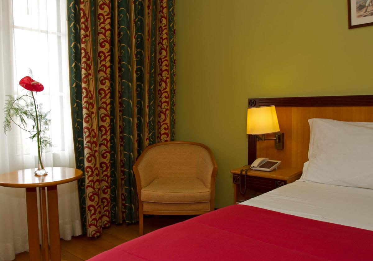 Uma cama ou camas num quarto em Hotel Quinta Bela S Tiago