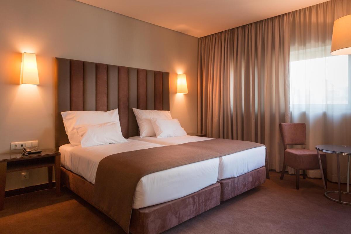 Uma cama ou camas num quarto em Vila Gale Collection Braga