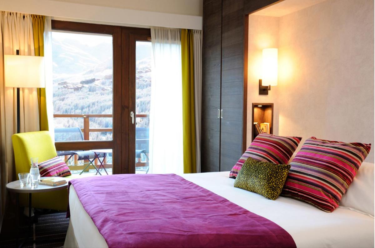 Un ou plusieurs lits dans un hébergement de l'établissement Hotel Le Savoy