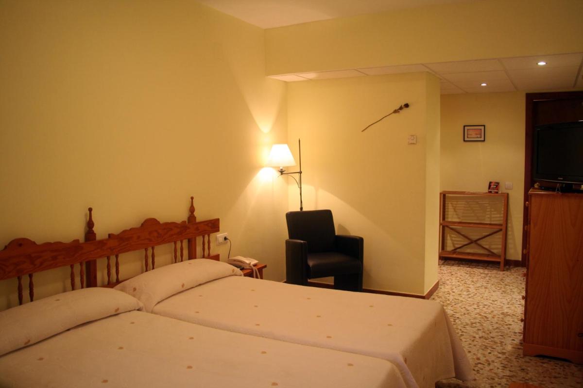 Cama o camas de una habitación en Hotel Castellote