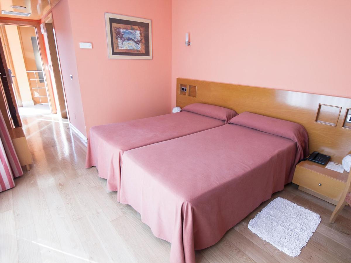 Cama o camas de una habitación en Hotel La Estación de Luanco